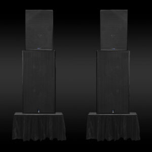 Meyer Sound CQ-2 loudspeakers with dual 18 inch 700-HP subwoofers on risers at a live event