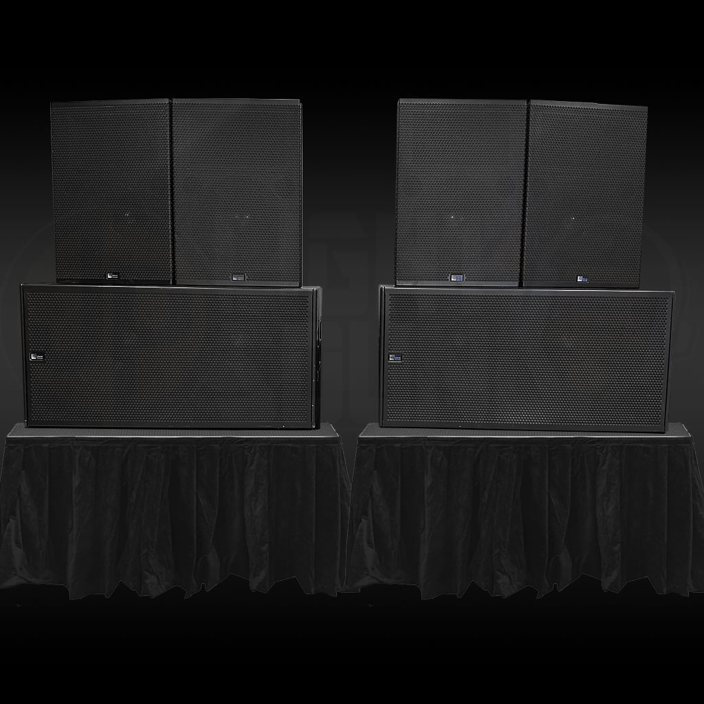 Meyer Sound CQ-2 loudspeakers with dual 18 inch 700-HP subwoofers on risers at a live event